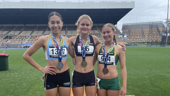 Sharnti Woodham, middle, with Paige Grose and April Fischer, left.