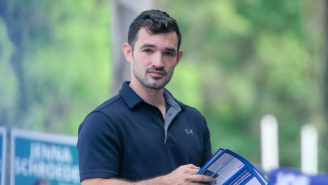 Murder-accused councillor Ryan Bayldon-Lumsden  handing out how to vote material at Arundel State School.Picture: Glenn Campbell