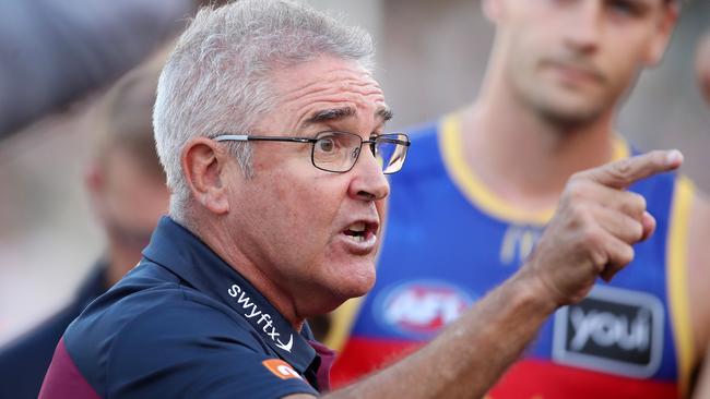 Lions coach Chris Fagan gives his players a bake. Picture: Sarah Reed/AFL Photos via Getty Images