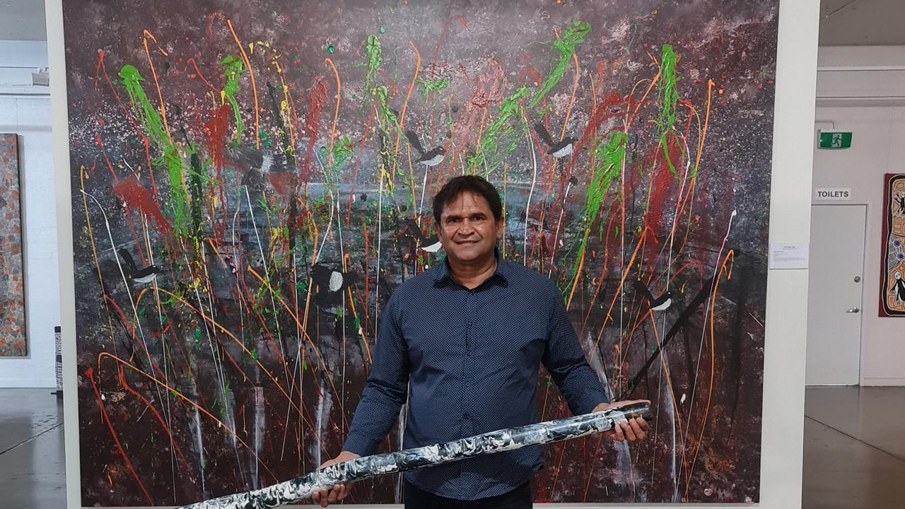 First Nations artist Nicky Winmar with his artwork which was once previously exhibited at the Mitchelton Gallery of Aboriginal Art. Picture: Adam Knight