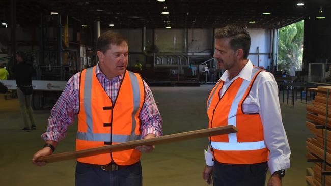 MP Llew O'Brien and DTM Timber General Manager Ian Haines inspect a newly manufactured piece of timber at DTM Timber in Maryborough. Photo: Stuart Fast