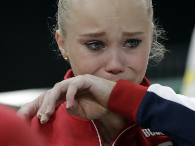 Russia’s Angelina Melnikova cries as she leaves the arena after competing in the artistic gymnastics