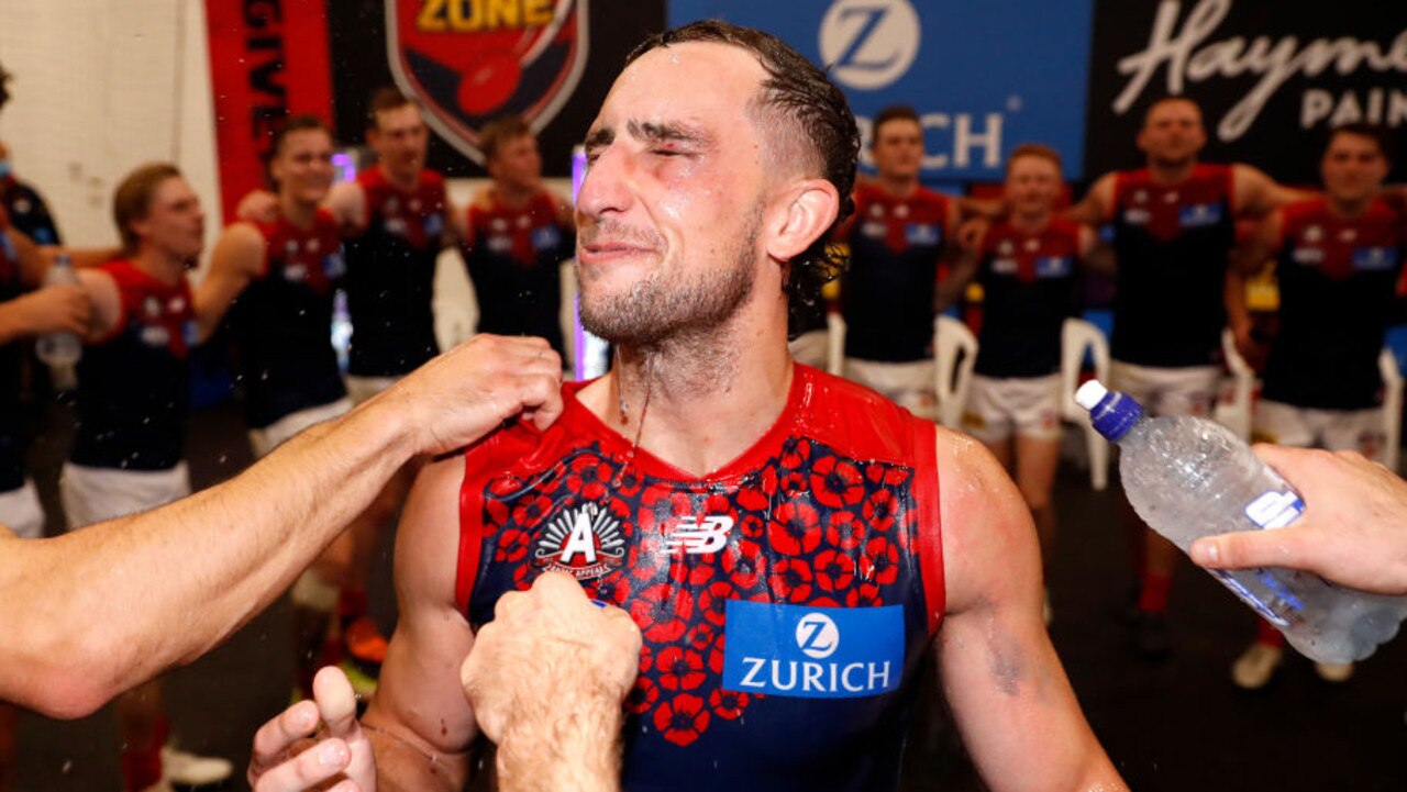 MELBOURNE, AUSTRALIA - APRIL 24: Luke Dunstan of the Demons receives a Powerade shower during the 2022 AFL Round 06 match between the Richmond Tigers and the Melbourne Demons at the Melbourne Cricket Ground on April 24, 2022 in Melbourne, Australia. (Photo by Dylan Burns/AFL Photos via Getty Images)