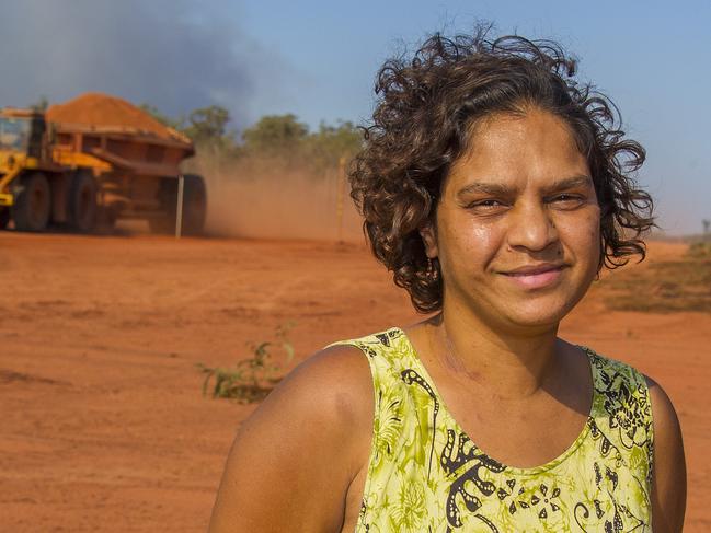 Ex Cairns Australia to The Australian Bauxite Deal for Aurukun - story Patricia Kevalas Bauxite - You're Standing On It. Aurukun resident Keri Tamwoy on bauxite land ... pic by Brian Cassey Pic by Brian Cassey