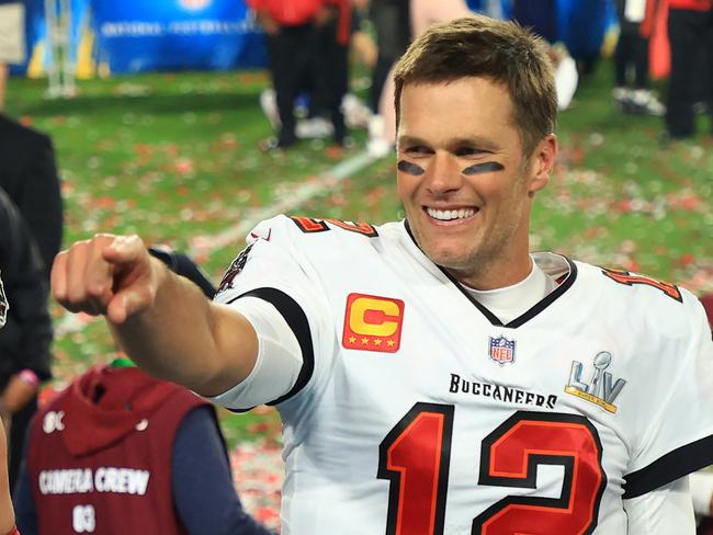 (FILES) In this file photo taken on February 07, 2021, Tom Brady of the Tampa Bay Buccaneers celebrates after defeating the Kansas City Chiefs in Super Bowl LV at Raymond James Stadium in Tampa, Florida. - Brady has agreed to a contract extension with the Tampa Bay Buccaneers that will enable the Super Bowl champions to keep other top players, according to multiple reports on March 12, 2021. (Photo by Mike Ehrmann / GETTY IMAGES NORTH AMERICA / AFP)