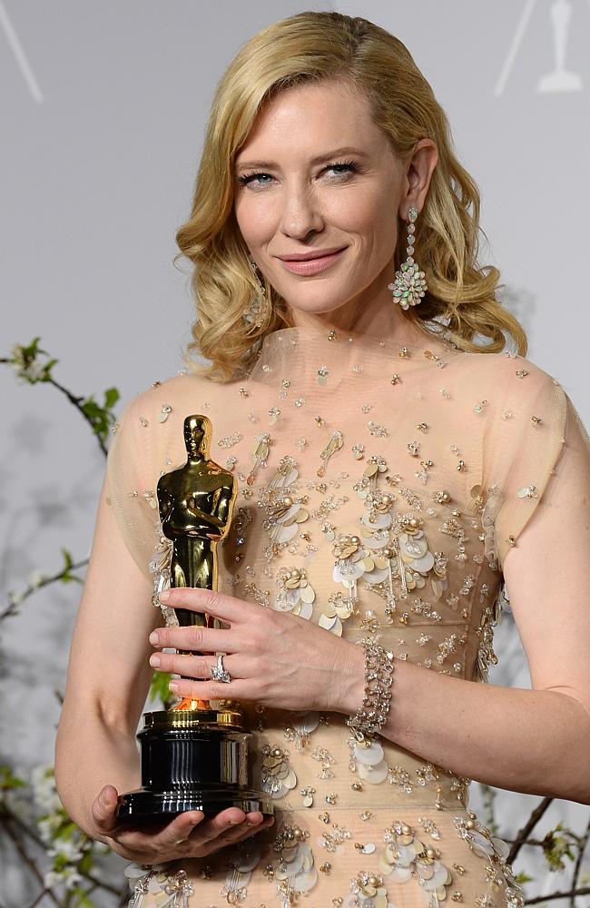 Golden girl ... Cate Blanchett poses in the press room with  her Best Actress Oscar. 