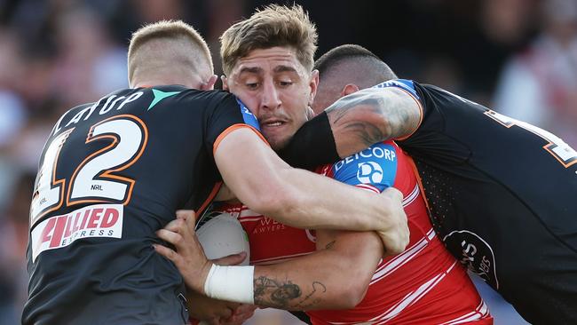 SYDNEY, AUSTRALIA - APRIL 14:  Zac Lomax of the Dragons is tackled during the round six NRL match between Wests Tigers and St George Illawarra Dragons at Campbelltown Stadium, on April 14, 2024, in Sydney, Australia. (Photo by Matt King/Getty Images)