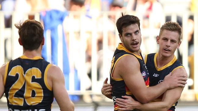 Darcy Fogarty celebrates one of his five goals with David Mackay. Picture: Paul Kane/Getty Images