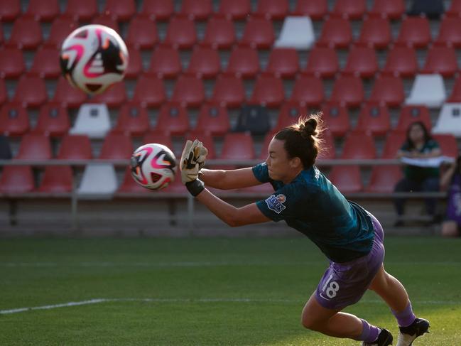 Mackenzie Arnold goes through through drills before the game. Picture: Getty