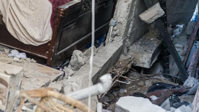 The body of a woman is seen under the rubble in the neighbourhood of Dexia 6, Les Cayes. Picture: AFP