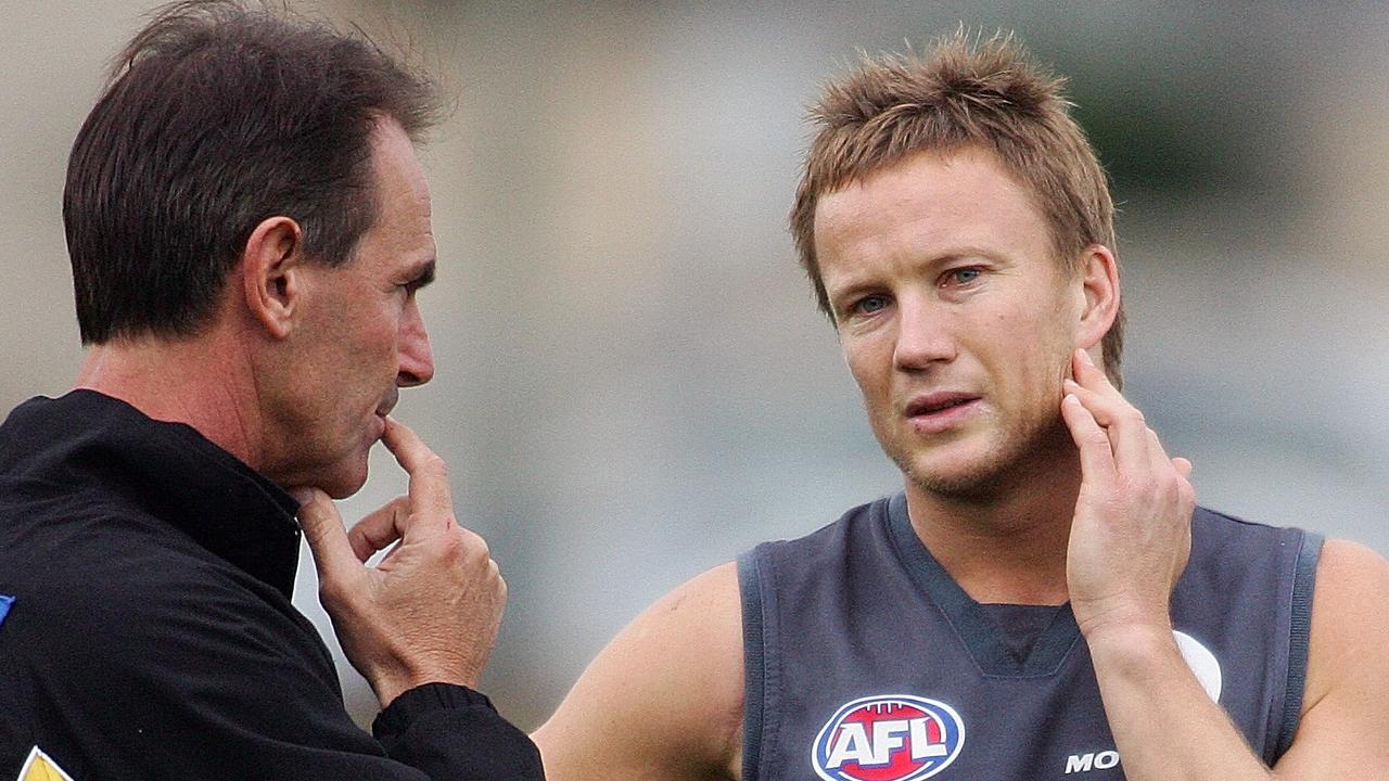 Terry Wallace talks with Nathan Brown during their Richmond days.