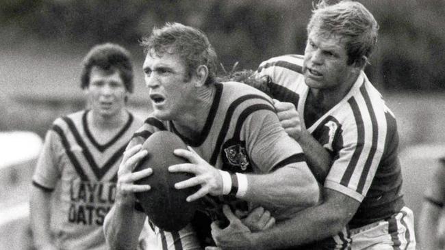 File pic - Redcliffe forward Forrester Grayson (R) trying to hold Easts Des Morris, Easts Brad Sully (L) & b/g (L-R) Errol Slingsby & Greg Holben at Langlands Park 11 Mar 1979 - sport rugby league action 35/P/4745/9 BRL QRL