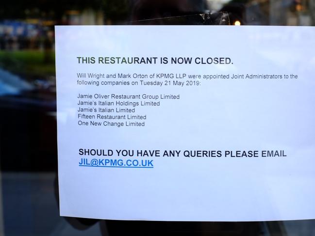 A sign announces the closure of a Jamie's Italian restaurant in Glasgow. Picture: AFP