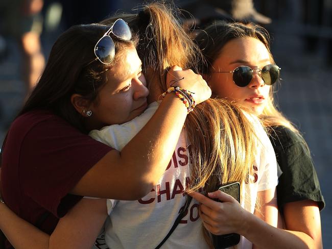 People attend a candlelit memorial service for the victims of the shooting at Marjory Stoneman Douglas High School that killed 17 people. Picture: Joe Raedle/Getty Images/AFP