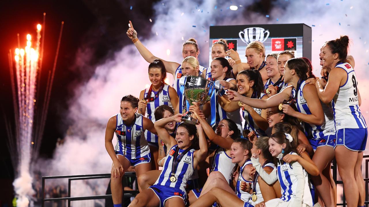 North Melbourne celebrates under lights after winning the first AFLW grand final to be held at night. Picture: Morgan Hancock / Getty Images