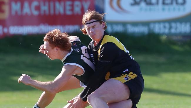 Rochester’s Mitch Cricelli tackles Echuca’s Callum Parsons.