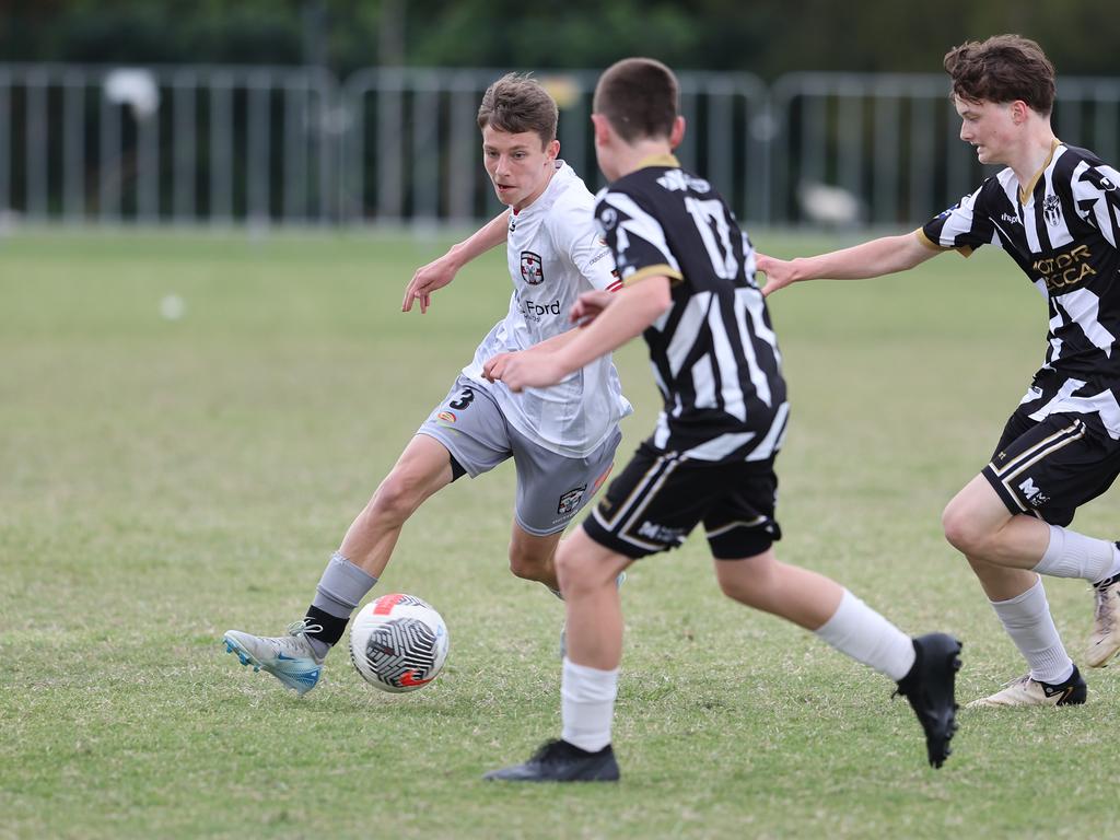 Premier Invitational Football 2024 tournament at Glennon Park Nerang. Field 5...Willowburn (black stripes) V Caboolture. Picture Glenn Hampson