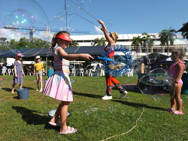 Eight-year-old Bea Berrow playing with bubbles at the 2024 Darwin International Laksa Festival on Sunday, November 3. Picture: Zizi Averill