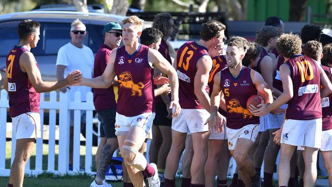 Palm Beach Currumbin players run onto the ground. QAFL game between Morningside and Palm Beach Currumbin. Saturday May 22, 2021. Picture, John Gass