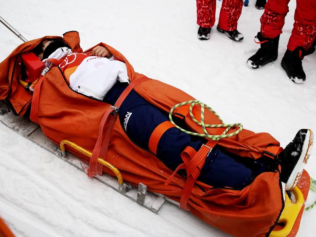 Yuto Totsuka of Japan is stretched off by medical staff after crashing in the during the Snowboard Men’s Halfpipe Final on day five of the PyeongChang 2018 Winter Olympics at Phoenix Snow Park on February 14, 2018 in Pyeongchang-gun, South Korea. Picture: Getty Images