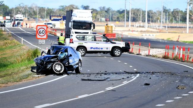 Emergency services attend a fatal car crash on the Bruce Highway, south of Townsville at Mount Surround. Picture: Alix Sweeney