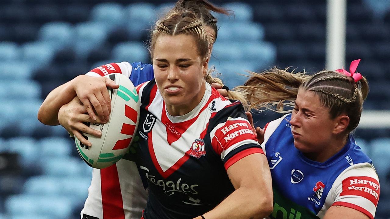 SYDNEY, AUSTRALIA - SEPTEMBER 29: Isabelle Kelly of the Roosters is tackled by Sheridan Gallagher of the Knights during the NRLW Semi Final match between Sydney Roosters and Newcastle Knights at Allianz Stadium on September 29, 2024 in Sydney, Australia. (Photo by Jeremy Ng/Getty Images)