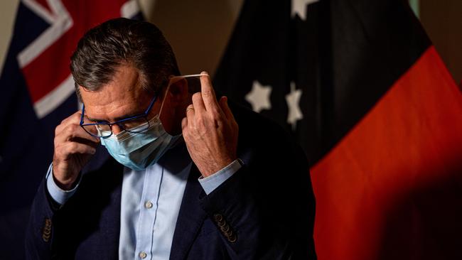 Northern Territory Chief Minister Michael Gunner removes his mask. Picture: Che Chorley