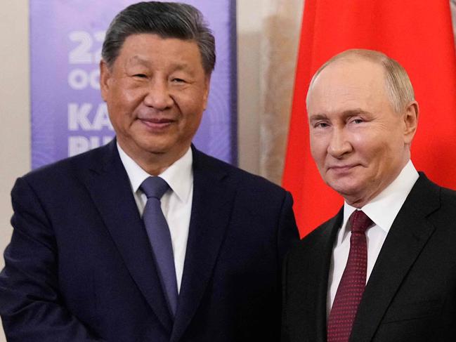 Russia's President Vladimir Putin meets with Chinese President Xi Jinping on the sidelines of the BRICS summit in Kazan on October 22, 2024. (Photo by Alexander Zemlianichenko / POOL / AFP)