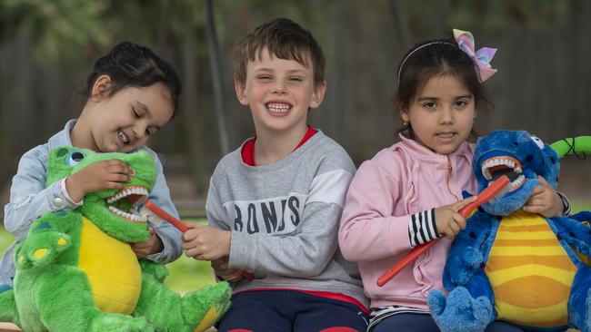 Amelia, Toby and Razanne learn the importance of good brushing in Glenroy. Picture: Andy Brownbill