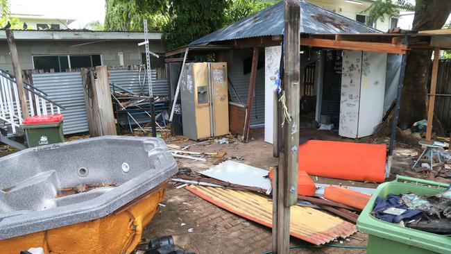 The trashed backyard of the property showing a heap of abandoned junk. Picture: Peter Carruthers