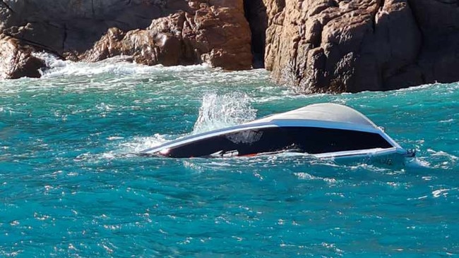 A capsized boat off Eshelby Island in the Whitsundays. Picture: VMR Whitsundays