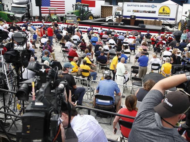 MSupporters wait for Donald Trump to speak at Flavor 1st Growers &amp; Packers in Mills River, North Carolina. Picture; AFP.