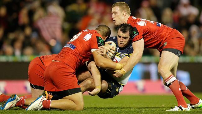 WOLLONGONG, AUSTRALIA - JULY 04: Kane Linnett of the Cowboys is tackled during the round 17 NRL match between the St George Illawarra Dragons and the North Queensland Cowboys at WIN Stadium on July 4, 2015 in Wollongong, Australia. (Photo by Mark Metcalfe/Getty Images)