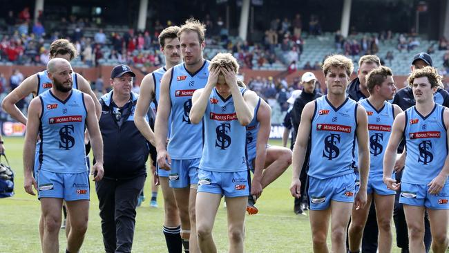 Sturt players leave Adelaide Oval after Sunday’s loss to North. Picture: Sarah Reed