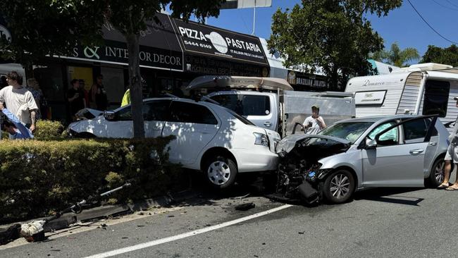 A ute towing a caravan was travelling north on Brisbane Road at Mooloolaba when it veered into oncoming traffic and struck five vehicles, including a parked car, which was pushed into a gardener who died.