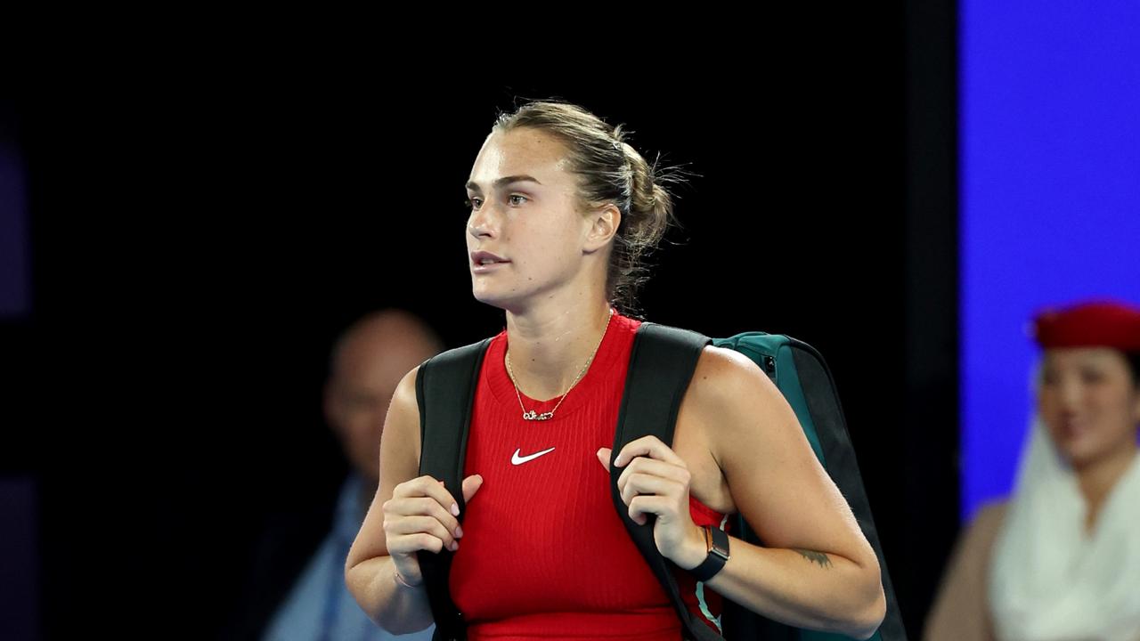 Sabalenka walks onto court in front of a largely empty Rod Laver Arena just before midnight on Sunday. Picture: Getty