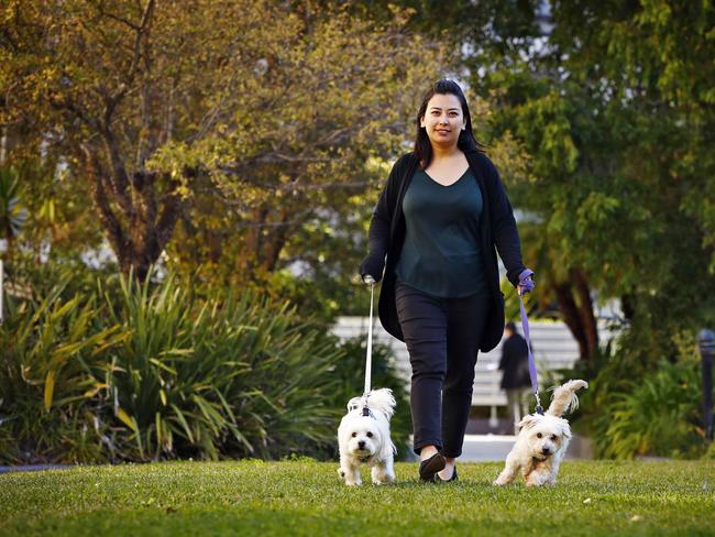 Sneha Shakya with dogs Arty and Lucky her adopted dogs at Wolli Creek today. Picture: Sam Ruttyn