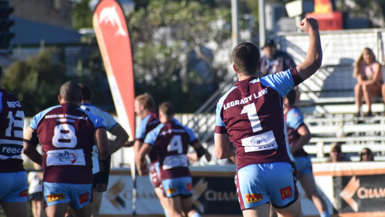 CQ Capras' fullback Blake Moore celebrates teammate Tom Farr's first try in the game against Souths Logan. Photo: Pam McKay