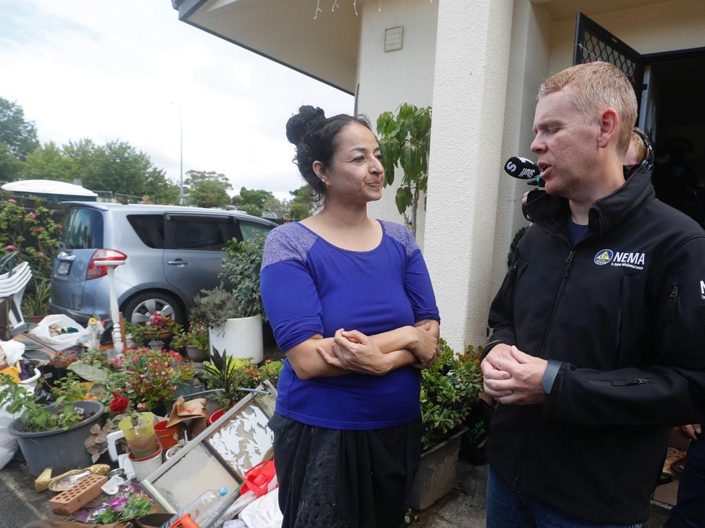 Prime Minister Chris Hipkins talks to residents affected by flooding in Clover Park, Henderson and West Auckland. Picture: New Zealand Herald/Dean Purcell