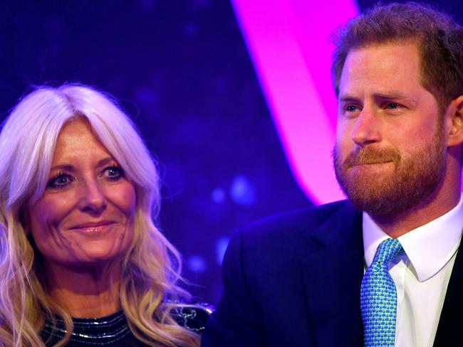 Britain's Prince Harry, Duke of Sussex (R) stands alongside television presenter Gaby Roslin as he delivers a speech during the annual WellChild Awards in London on October 15, 2019. - WellChild is the national charity for seriously ill children and their families. The WellChild Awards celebrate the inspiring qualities of some of the country's seriously ill young people and the dedication of those who care for and support them. (Photo by TOBY MELVILLE / POOL / AFP)