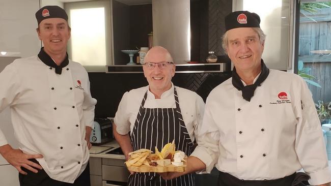 TAFE Queensland Gold Coast Tafe cookery teacher Damian Tiedeman (centre) with students.