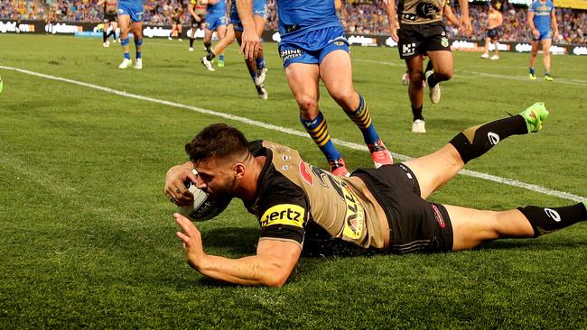 Josh Mansour scores a try against the Eels.