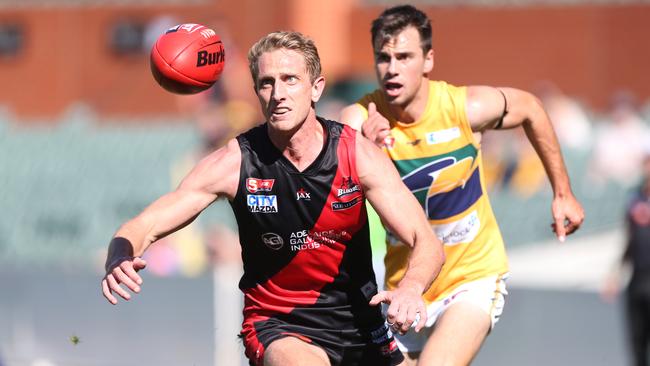 Bloods captain Chris Schmidt reaches for the ball in front of Eagle Chris Hall in 2016. Picture: Stephen Laffer