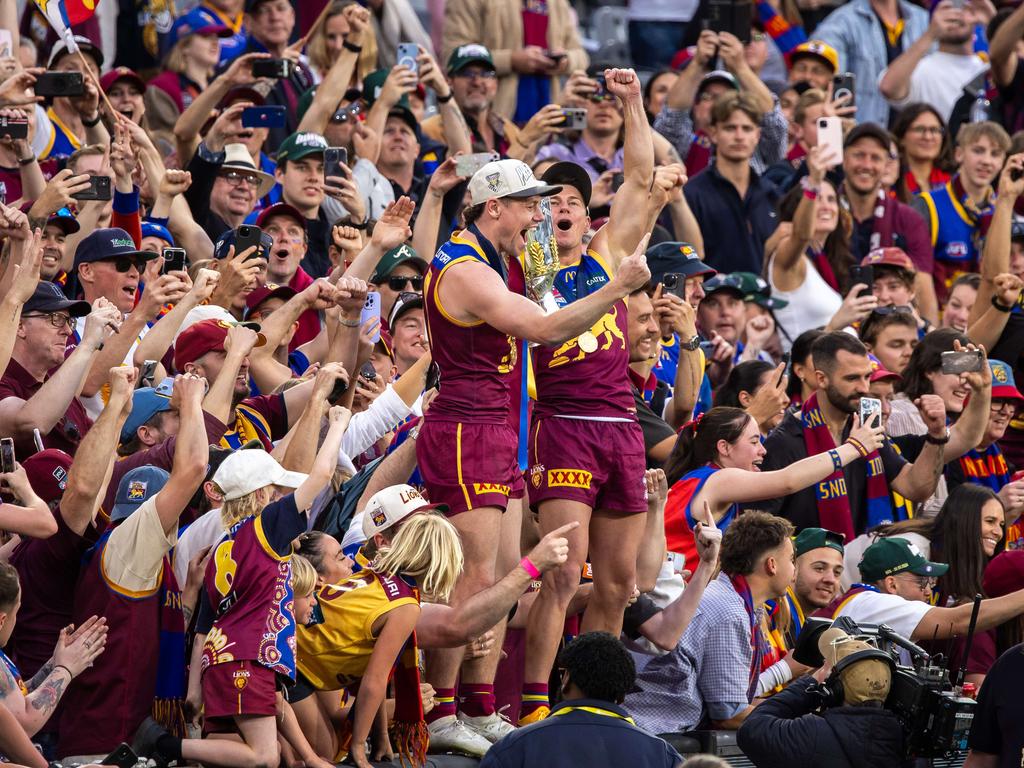 Lachie Neale and Dayne Zorko in the crowd after the win. Picture: Jason Edwards