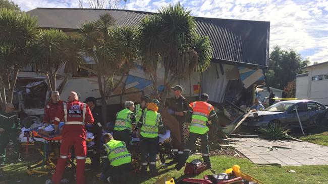 Emergency services survey the scene after a truck ploughed into a two-storey home on Carrickalinga Rd at Carrickalinga. Picture: Gary Juleff