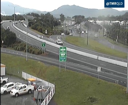 A cheeky cockatoo visits a traffic camera over the Bruce Highway in Cairns