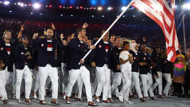 Michael Phelps of the US carries the flag during the Opening Ceremony of Rio 2016.