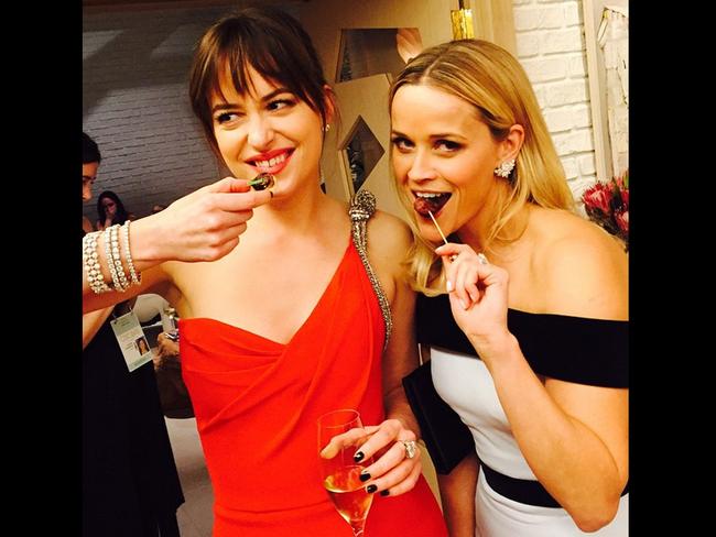 Reese Witherspoon at an Oscars party 2015 via Instagram, “50 shades of #grazing... #Horsdoeuvres #AboutLastNight #Oscars #DakotaJohnson”