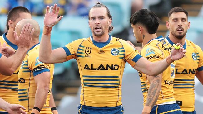 SYDNEY, AUSTRALIA - APRIL 10: Clint Gutherson of the Eells  celebrates scoring a try during the round six NRL match between Wests Tigers and Parramatta Eels at Accor Stadium on April 10, 2023 in Sydney, Australia. (Photo by Mark Metcalfe/Getty Images)