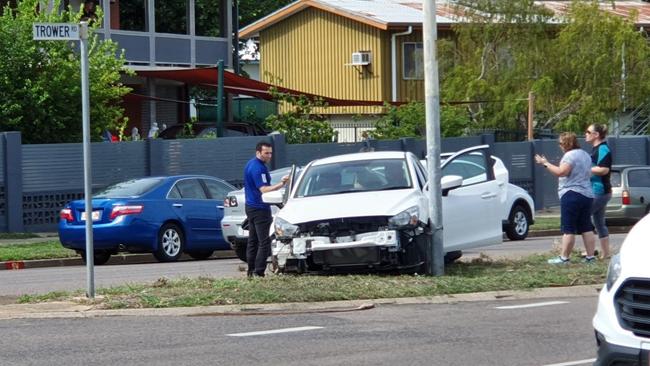 A white sedan that was pushed into the median strip and light pole on Trower Rd after it was hit by a red 4WD last January. Picture: Kieran Banks